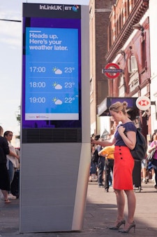 Woman using InLinkUK tablet in London