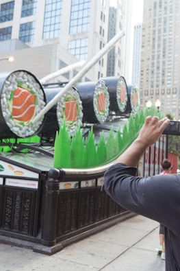 Man photographs GrubHub sushi ad campaign on top of Chicago CTA subway entrance