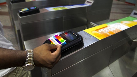 Person scans vitaminwater card to enter Chicago station