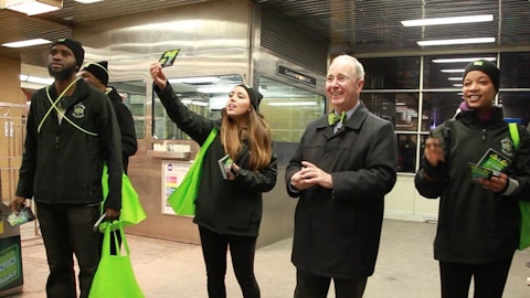 Representatives pass out H&R Block flyers in Chicago CTA station