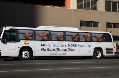 Full view of DART bus with Dallas Morning News ad campaign