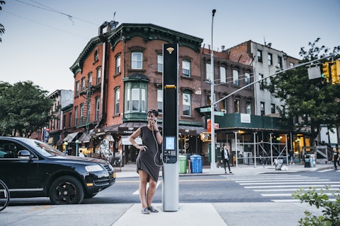 Person makes a phone call at a Link in Brooklyn