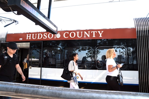 NJ Transit train with Carepoint Hudson County advertisement