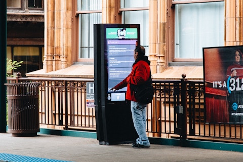 User browses transit information in Chicago on IxNTouch kiosk