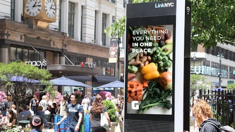 LinkNYC kiosk with retail brand mockup ad in front of Macy's in New York City - Digital Out of Home ad