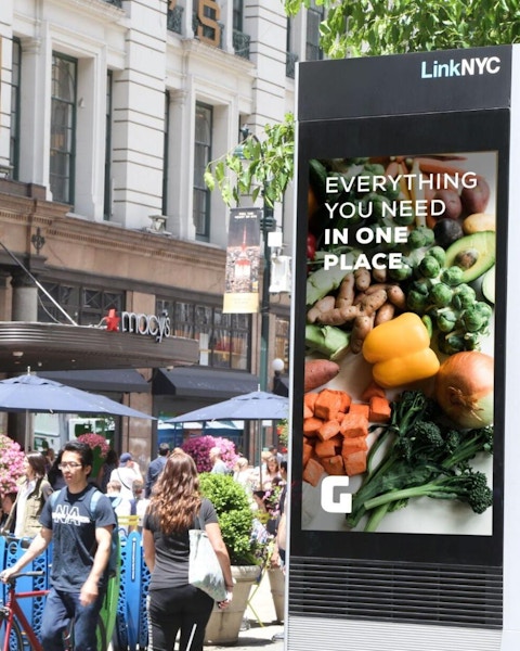 LinkNYC kiosk with retail brand mockup ad in front of Macy's in New York City - Digital Out of Home ad